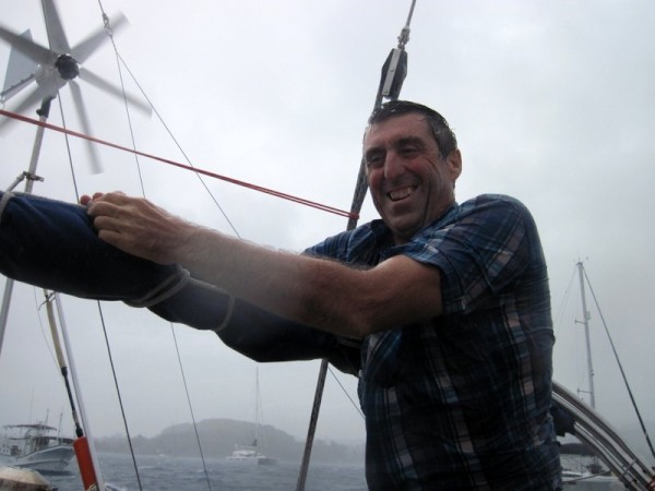 Andy ties down the bimini to stop it flying away in strong winds.