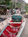 A traditional fishing boat. The keel is a dug out canoe with additional freeboard added with planks of wood.