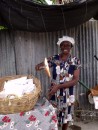Greta George selling bread in Anse La Raye on the west coast of St Lucia. A lady of 67-years with 8-children who started a bread business after her husband passed away to support her family.