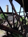 Close up of the disused waterwheel and sugar factory beyond.