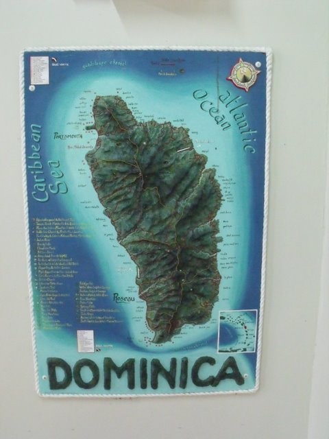 The shape of Dominica - The Sandemans Port Man from Oporto leaning forwards to insist we don
