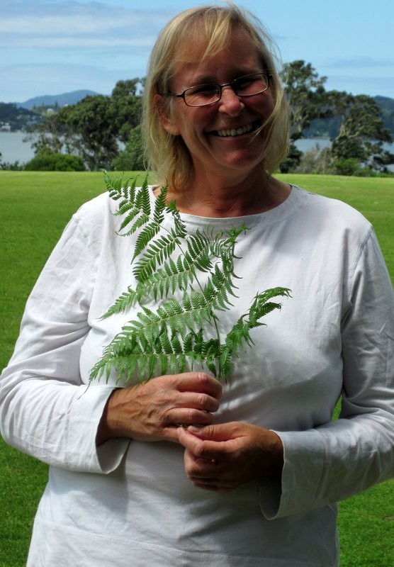 Sue with the symbol of New Zealand.