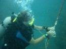 Sue tying knots underwater in preparation for recovery practise using air bags