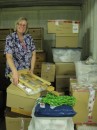 Sue, moving boxes around in our storage unit. Lots more to pack in but we are nicely organised now.