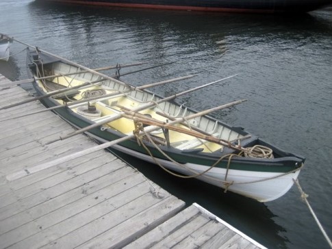 A whale boat. Used to take the harpooner to the whale.