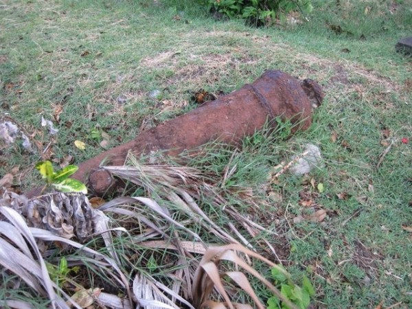 A part buried cannon at the cemetery near the Caribs Leap