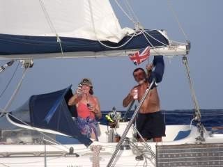 Keith and Welly aboard Rapau celebrating crossing the Tropic of Cancer for the first time.
