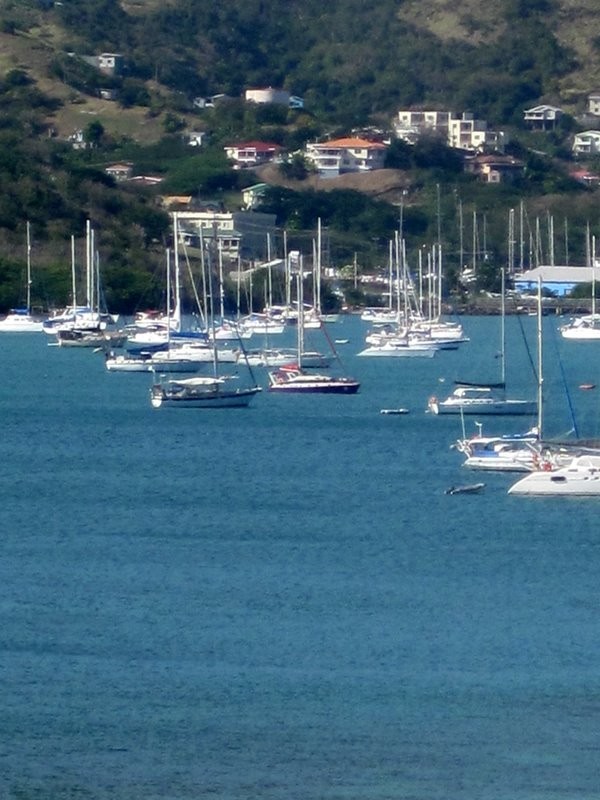 Spruce at anchor in Prickly Bay - Left of centre and the first boat from bottom of picture - with sun awning rigged.
