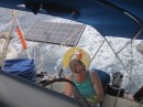 Sue helming on the wind, solar panel deployed under way
