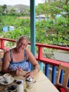 Sue catching up on her diary at Cocos, Bequia