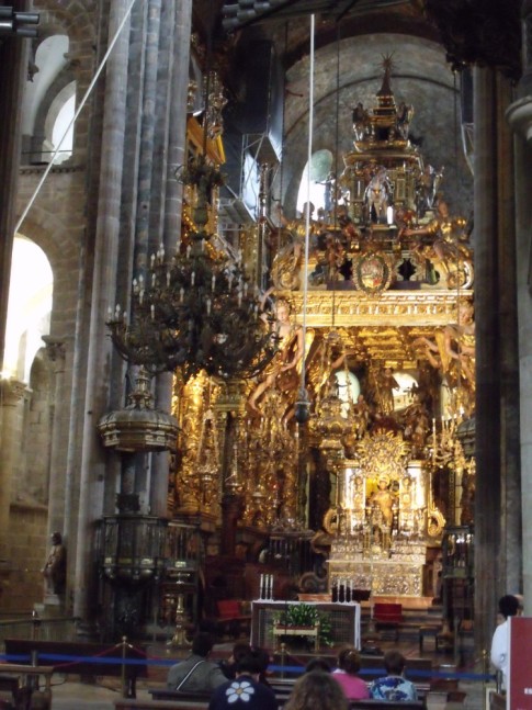 Splendorous golden decoration on the carved wood altar within the Cathedral at Santiago del Compostela.