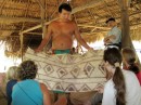 Ivan shows the group the traditional cloth worn by the Embera, it is made out of tree bark and is very scratchy. 
