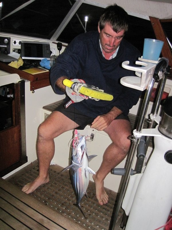 Andy tackling the juicy tuna caught at first light.