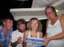 Opening the present carried from La Gomera by Pete and Kourtney (Aboard Norna) and sent by friends Andy & Lesley Scott (aboard Kodiak still in the Canaries)