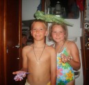 John and Sierra with their shark tooth necklaces and iguanas