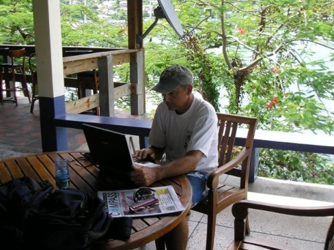 19 Menno doing some computer work at the Grenada Yacht Club.JPG
