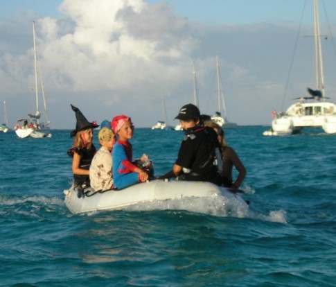 w Trick or treating in the dinghy with Sharky Mark driving.JPG
