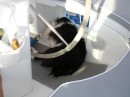 Daisy wedges herself under the helmsman seat while we are sailing and this prevents her from sliding back and forth!