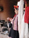 Local woman in The Sacred Valley spinning llama wool. 