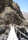 Heather crosses a sketchy bridge in Colca Canyon.
