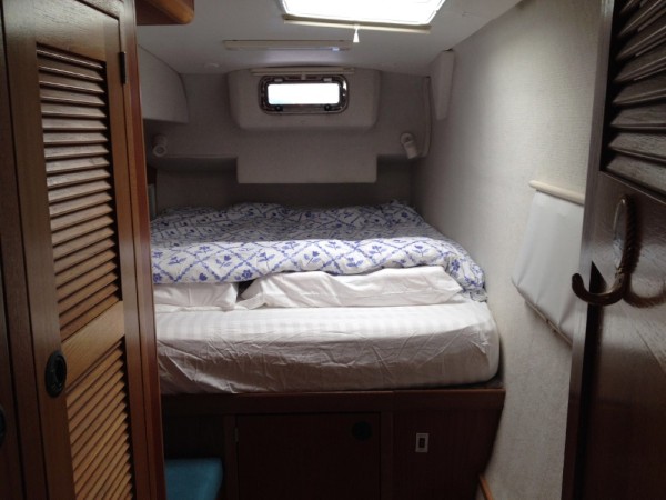 The owners stateroom has a full size queen berth with a custom inner-spring mattress.  It