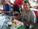 Raro: Allan dives into a healthy breakfast at the Saturday Market - Belgian waffle with mango and banana and whipped cream ... so yummy, we had two.