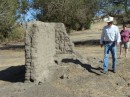 Irv and Martha approach remains of the old adobe homestead on his ranch near Shandon, CA
