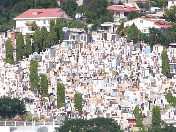 View of a cemetery on the shore in Basse-Terre from At Last sailing to Les Saintes