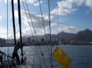 We are raising our yellow quarantine flag as we enter Mauritius - Shadow is taking photos from the bow of the boat