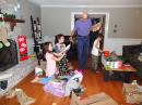 Christmas morning: Grandpa and the grandkids opening presents