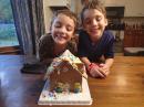 The twins: The finished gingerbread house, well what is left of it.