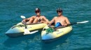 Linds & Bri take the kayaks ashore to Octopus Resort.