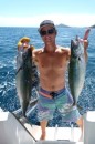 Bri shows off a couple of mackerel he caught back to back en route to Waya.  Guess what