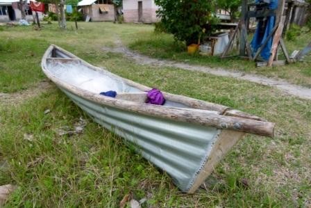 Neat fishing canoe made of corrugated roofing metal.