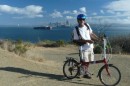 Norm with honkin big container ship and city in background.