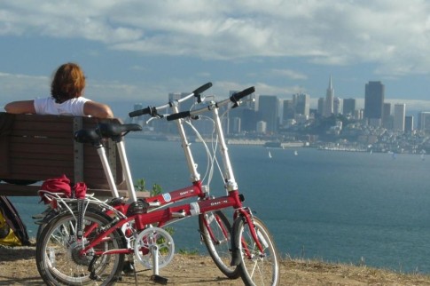 Beth enjoys a rest stop and great view of the city.  Our Dahon folding bikes are awesome for exploring places like Angel Island!