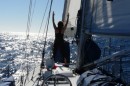 Beth doing yoga under sail on Sarah Jeans rolling foredeck.