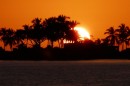 The sun sets behind the palms of Punta Camaron shortly after we anchored in Ensenada de Metanchen just south of San Blas.