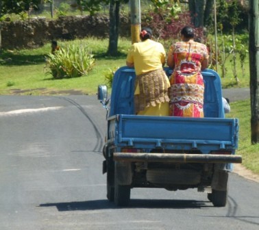 Tongan ladies catch a ride from a passing truck in Neiafu.