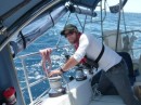 Kyle trims the head sails as we struggle to keep our speed down to 5 kts for dawn arrival.