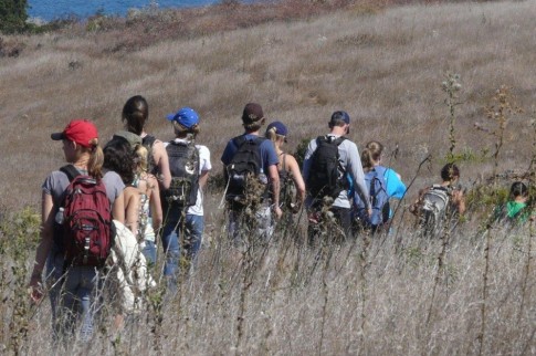 A group of hikers, brought by the ferry, pass us en route to pelican Bay.