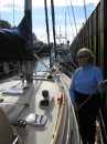 Jane tends lines to keep Voyageur in place after entering the lock.