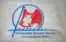 This stone on the shore of Lake Winnebago bears the name of the Oshkosh Yacht Club, established four years after the end of the Civil War, and its club burgee.