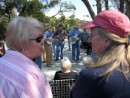 Jane and friend Marian enjoy the music of bluegrass musicians who gather at the Farmers Market every Saturday morning.