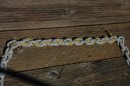 using colored nylon line woven thru the chain to mark every 25 feet. It feeds thru the windlass easily and can be spotted even at night!