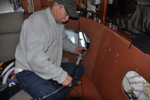 Tom showing off the back flow valve for the #2 bilge pump