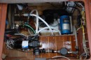 this shows the new "on demand" water pump that replaced our pump and accumulator tank. This gave us room to install the water maker hgh pressure pump. That the blue thing in the middle