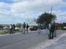 Our hiking group stops to chat on one of the main roads on Great Harbour Cay. Behind is a very nice house on the harbor.