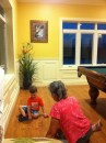 Adler and Grandma play jacks in the billiard room at the clubhouse at The Marina at Emerald Bay