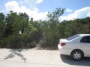 Rental car at head of path to beach at Thompson Bay, Long Island